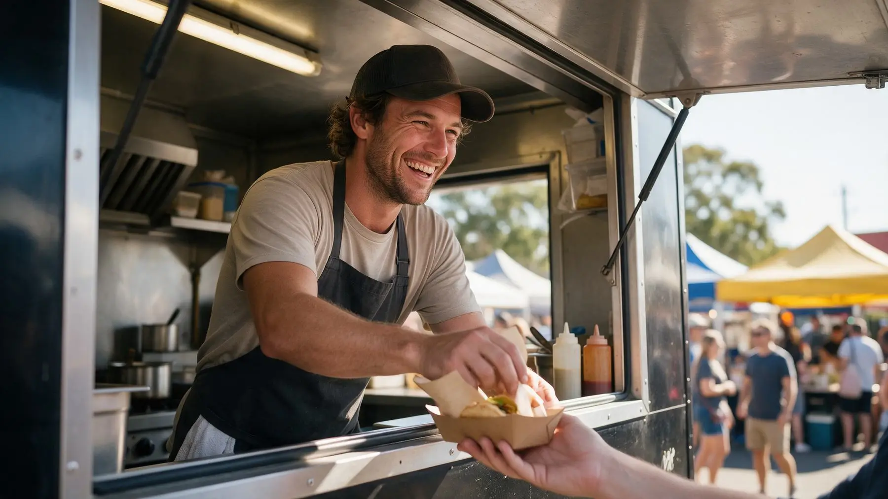 Food truck owner serving customers smiling, same day business loans
